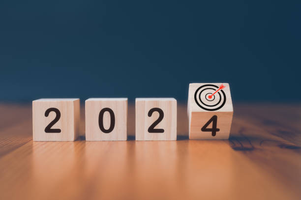 istock wooden cubes with the text  2024 and virtual arrow dart board  over background 1492643361