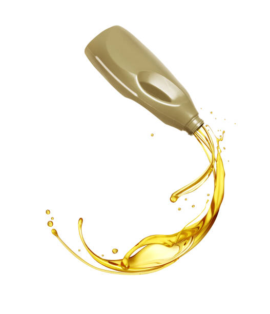 istock Splashes of engine oil pouring from a plastic container isolated on a white background 1492643375