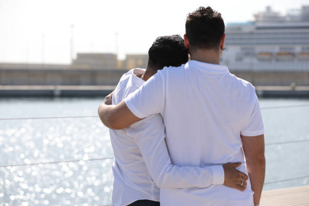 Gay couple at seaside and marina