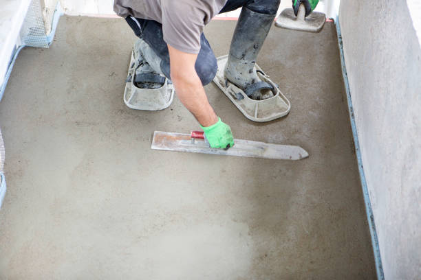 Laying and levelling screed on a balcony - construction site stock photo