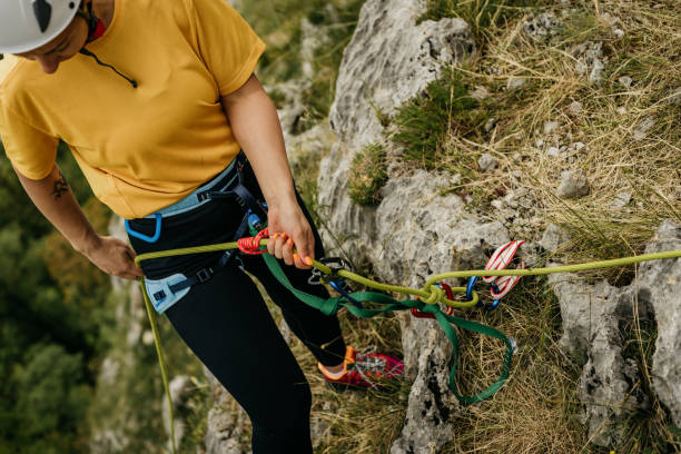 istock Professional female climber enjoys extreme challenges on steep mountain cliffs 1492645241