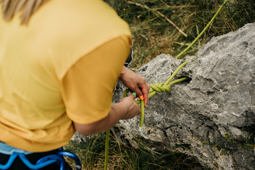 Close-up of an unrecognizable women preparing for climbing