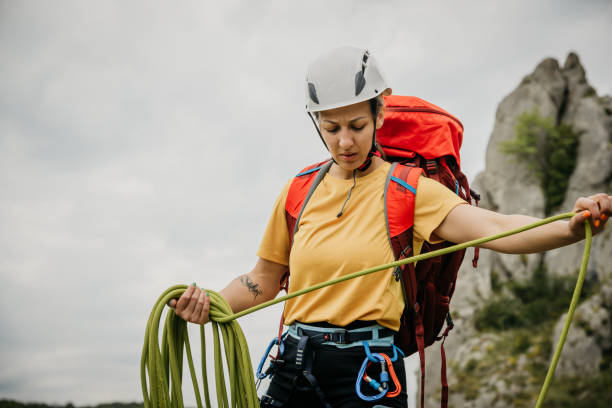 istock Girl climbs a rock 1492645999