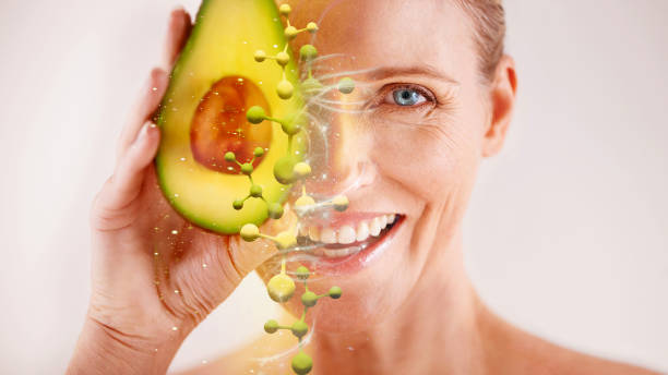 face, skincare and senior woman with avocado in studio isolated on a gray background. portrait, cosmetics overlay and happy female model with fruit for nutrition, vitamin c or healthy diet for beauty - make up women ceremonial makeup senior women imagens e fotografias de stock