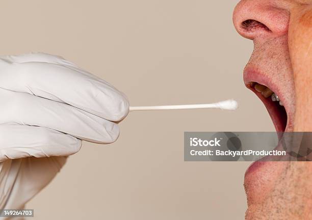 Side View Of A Mouth Open For A Dna Swab Stock Photo - Download Image Now - Medical Test, Medical Exam, Saliva Test