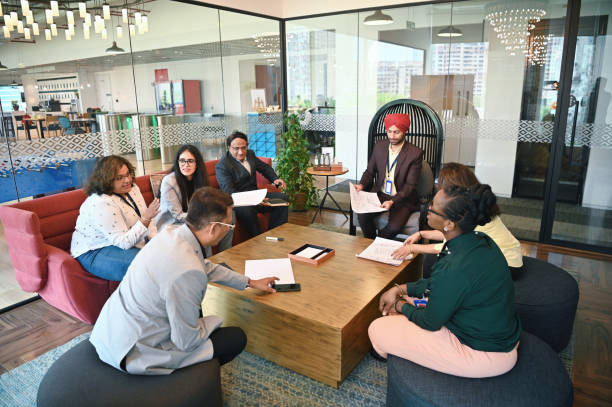 istock Diverse group of engineers brainstorming together in a meeting room 1492647675