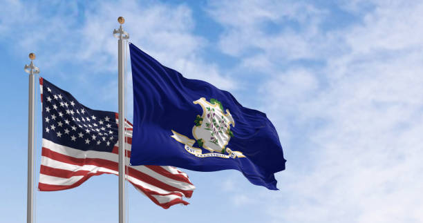 istock Connecticut and US flags waving in the wind on a clear day 1492648229