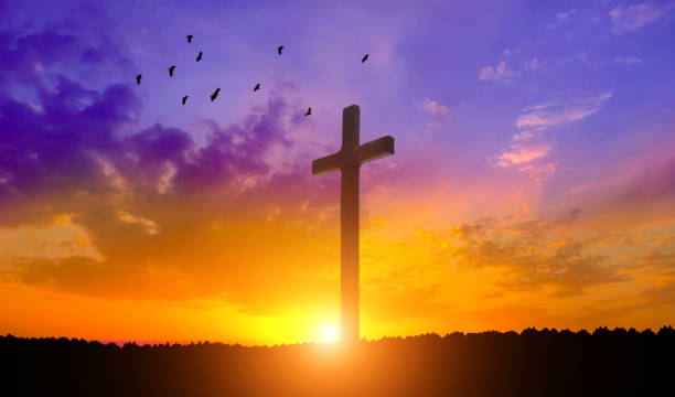 istock Good Friday concept. Cross in arm on sky background. 1492649003