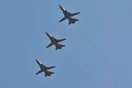 Three Sokhui Su-24 fighter planes fly in formation