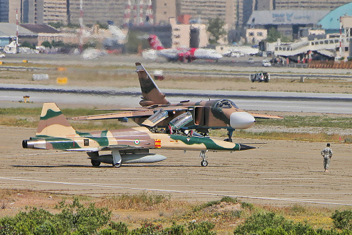 HESA Saeqeh and Sokhui Su-24, two jet fighter of Iranian army at the air force parade. Mehrabad Airport, Tehran.