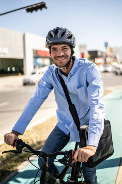 istock Portrait of young man using bicycle outdoors 1492651593
