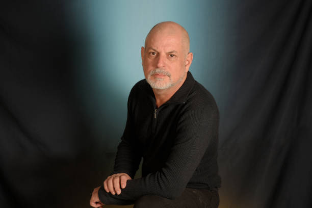 istock man with white beard gentleman in black shirt colored background landing in studio 1492652132