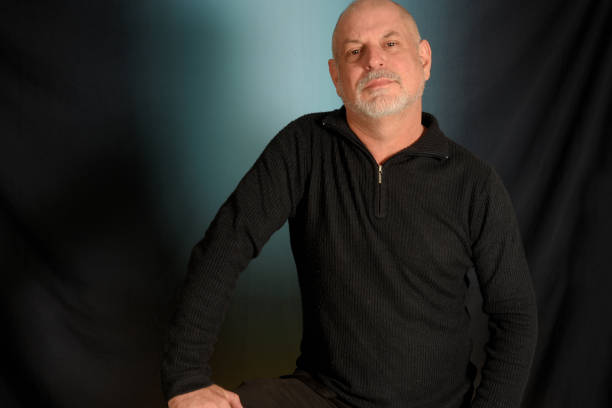 istock man with white beard gentleman in black shirt colored background landing in studio 1492652143