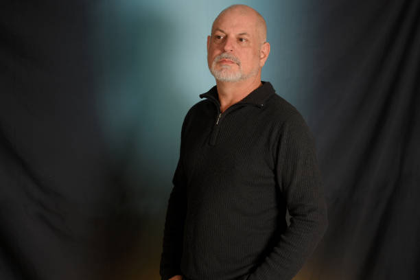 istock man with white beard gentleman in black shirt colored background landing in studio 1492652687