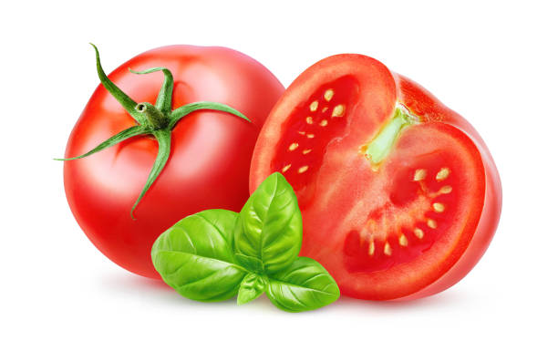 istock Cut tomatoes and leaf of basil, isolated on white 1492656332