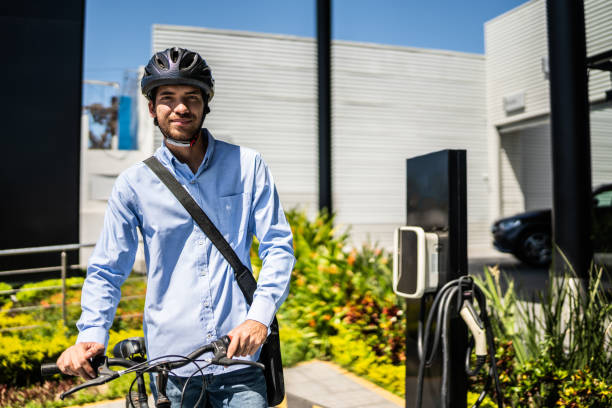 Portrait of young man using bicycle outdoors