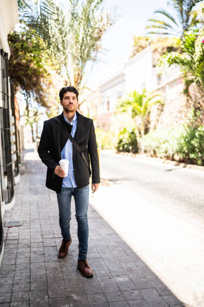 istock Young man walking outdoors 1492656919