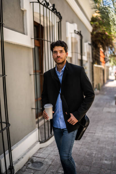 istock Portrait of young man walking on old town 1492656943