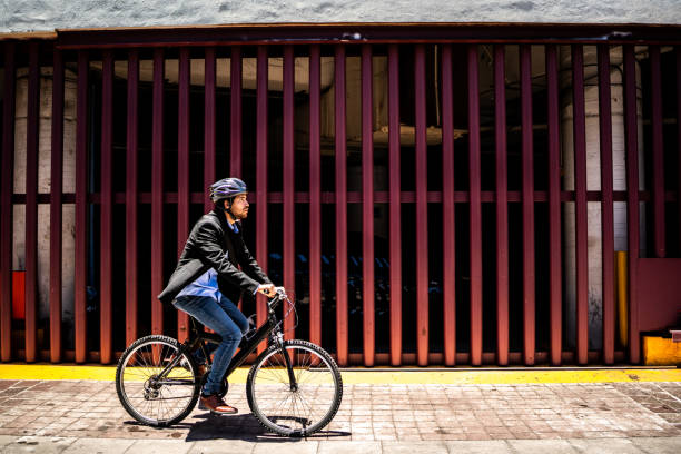 Young man riding bicycle outdoors