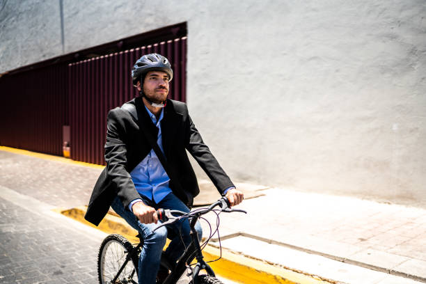 istock Young man riding bicycle outdoors 1492657263