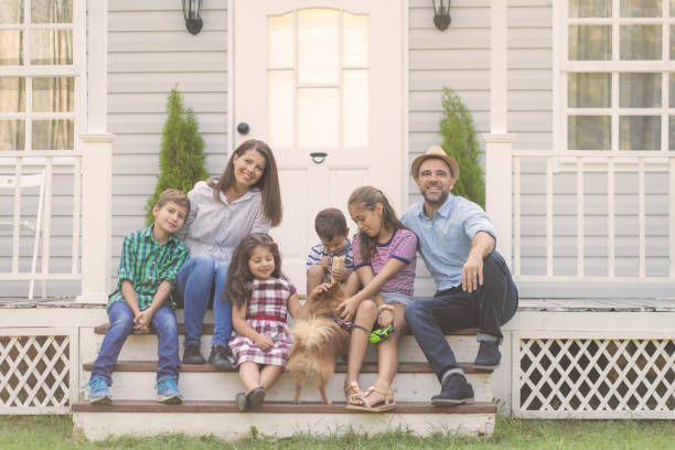 istock A family of six sitting on the steps 1492659663