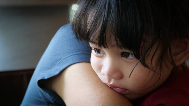 istock A loving mother hugs and comforts her little daughter. 1492661275