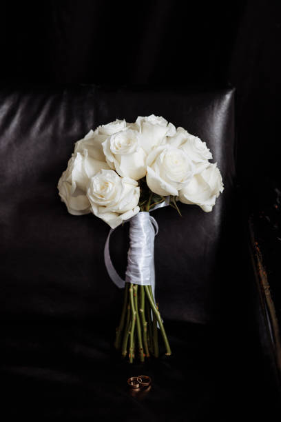 istock White wedding bouquet on a black background 1492661556