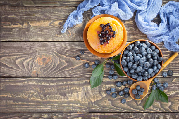 Blueberries with dessert on the table.