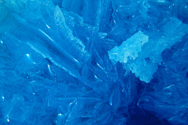 istock Blue crystalline mineral stone. Macro. Abstract technological background from crystals of the mineral in blue. Close-up 1492663657