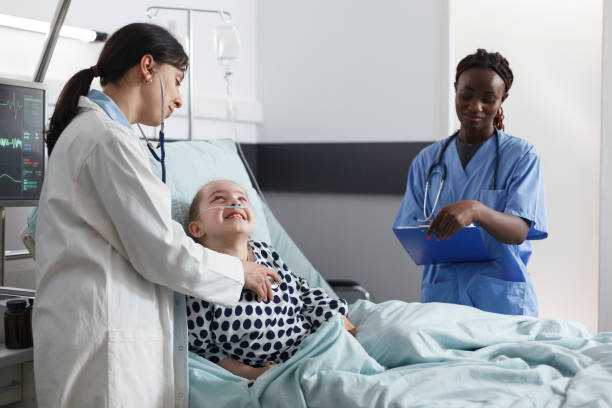 istock Pediatric clinic general practitioner specialist examining girl health condition using stethoscope. 1492663767