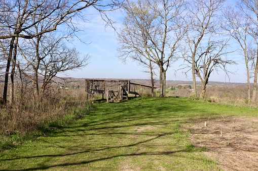 The old wood deck overlook in the park on a sunny day.
