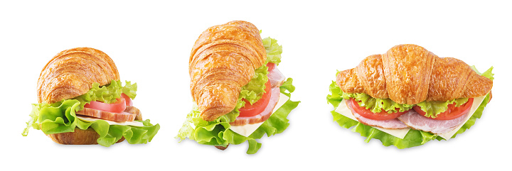 Meat cheese tomato croissant on a white isolated background. toning