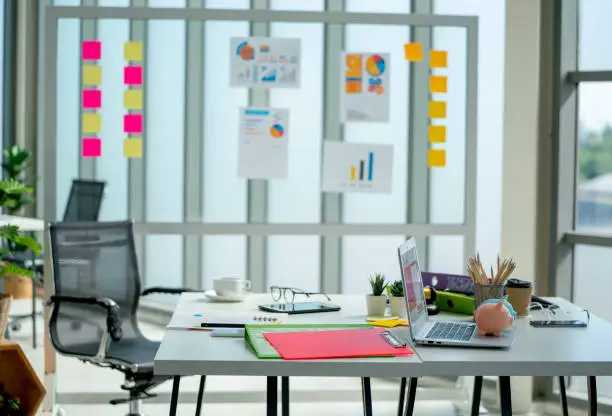 Empty room of business office with no people in the building with day light compose with accessories such as graph paper,