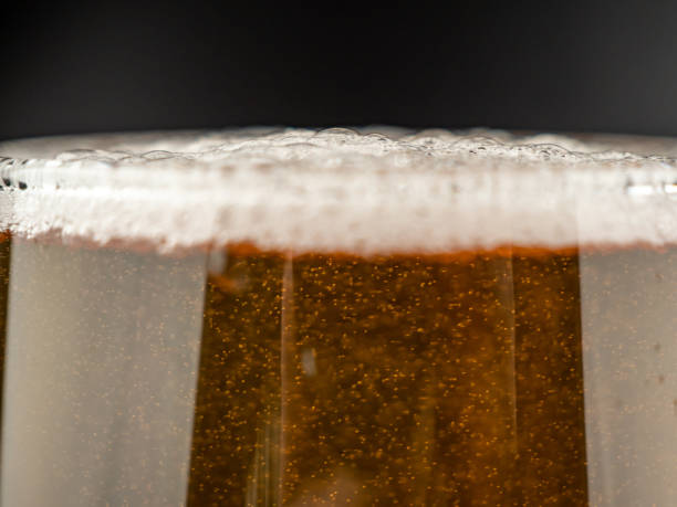 istock A glass of cold beer on a dark background. 1492667370