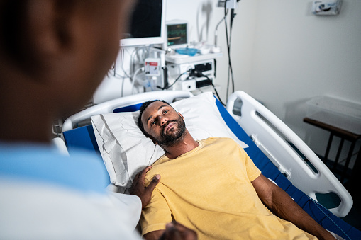 Patient listening to doctor in the hospital