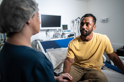 Patient listening to doctor in the hospital