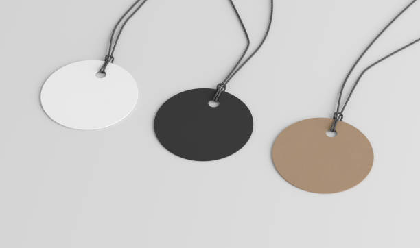 istock White, cardboard, black round tags mockup on white background. Side view 1492675441