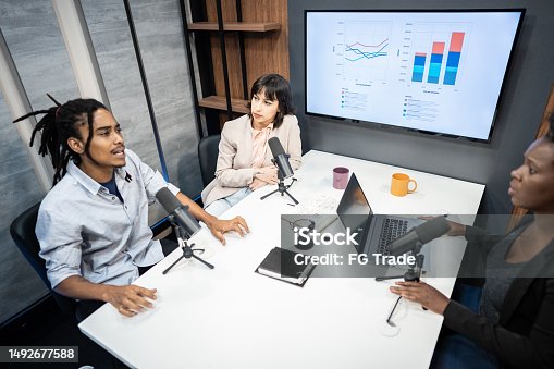 istock Coworkers during the recording of a podcast show 1492677588