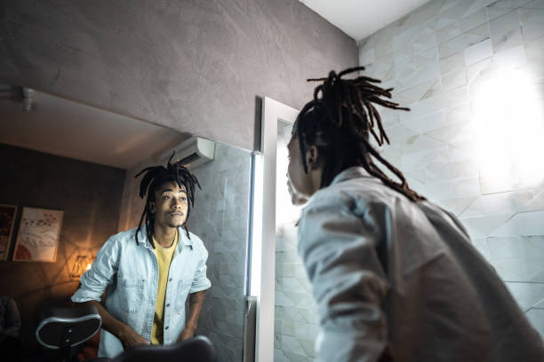 istock Young actor man looking in the mirror on dressing room of backstage 1492678132