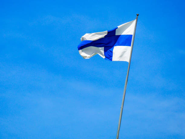 istock Low angle view of american flag against blue sky 1492678186