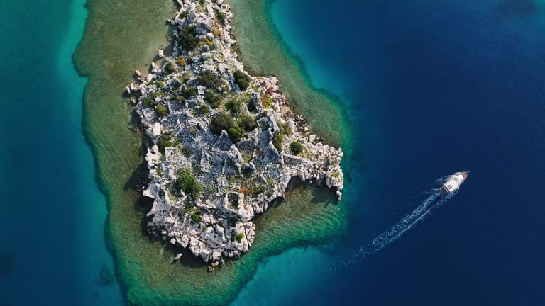 Simena - submerged ancient Lycian city Kekova island Ruins of ancient architecture, aerial view of sunken historical sunken city, place to explore submarine, clean submarine, discovery point for divers, a boat for a cruise in the sunken city