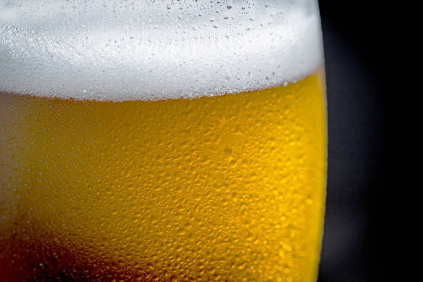 istock Light beer in a glass, on the table. 1492683713