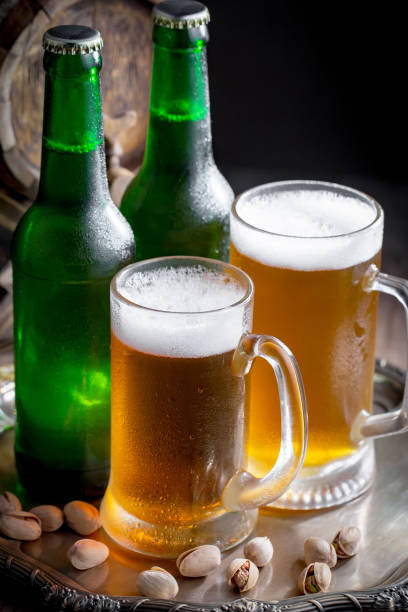 istock Light beer in a glass, on the table. 1492683752