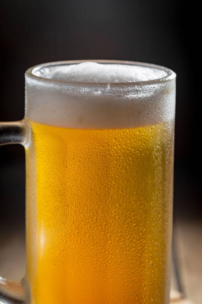 istock Light beer in a glass, on the table. 1492683777