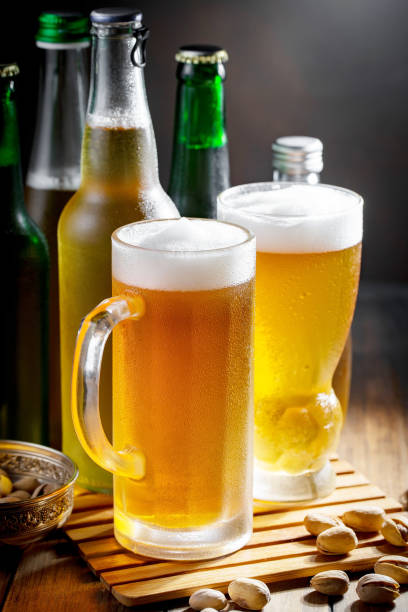 istock Light beer in a glass, on the table. 1492683806