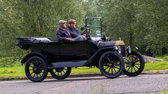 Stony Stratford, Bucks, UK Aug 29th 2021. 1916 black FORD MODEL T  classic car travelling on an English country road