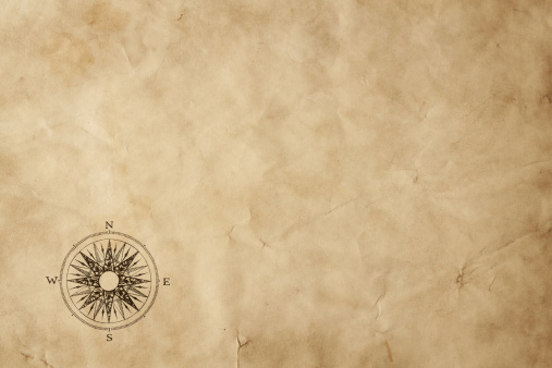 Old paper sheet with compass rose and copy space