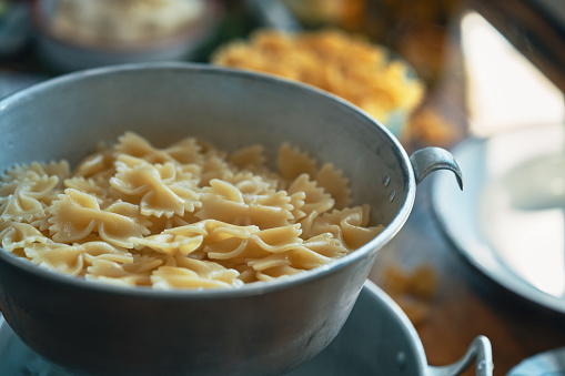 The base of the salad consists of farfalle pasta in greek style. The Greek Salad includes traditional ingredients like cucumber, bell pepper, olives and feta cheese.