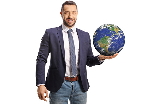 Young man holding the planet earth on his hand isolated on white background
