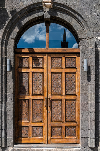 large wooden door used in historical stone built Diyarbakir houses. 
Shot with a full-frame camera in daylight.